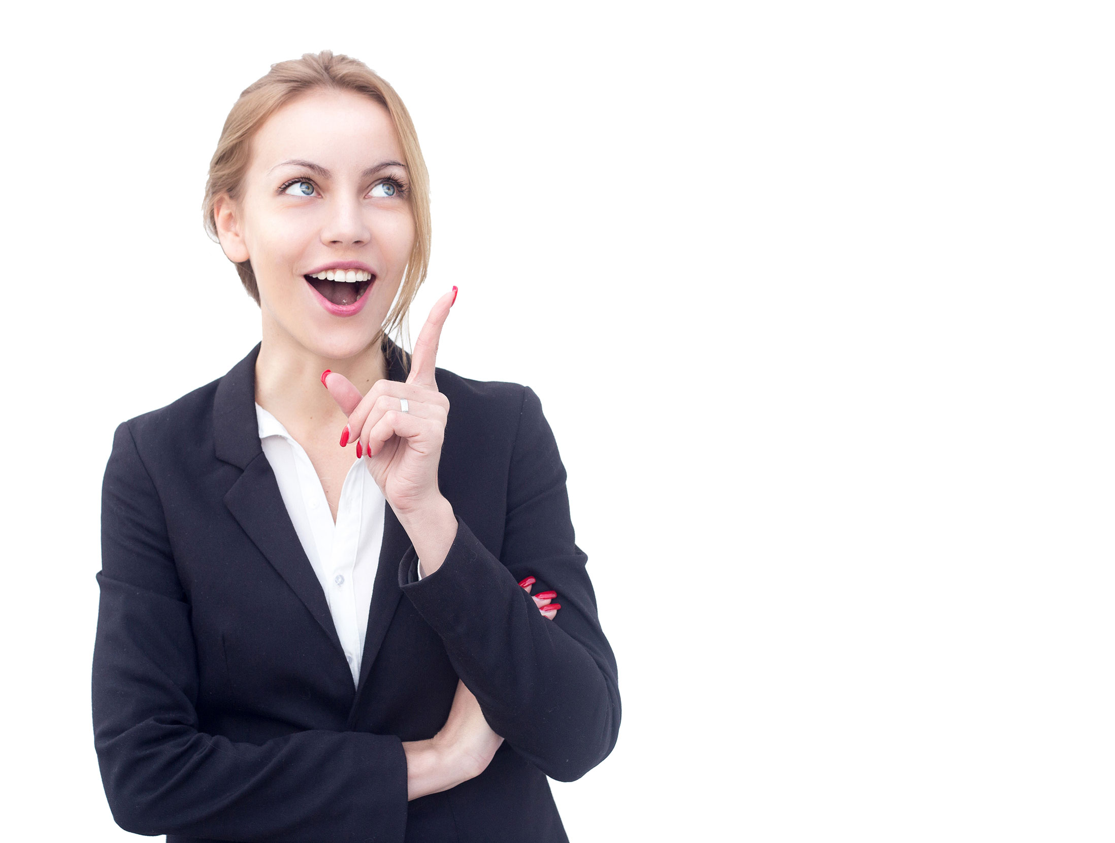A woman in business attire smiling and pointing up.